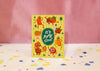 Greeting card with quirky illustrated tomatoes and 'It's Party Time!' text on a yellow background.