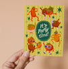 Greeting card with quirky illustrated tomatoes and 'It's Party Time!' text on a yellow background.