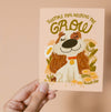 Greeting card with an illustrated dog surrounded by flowers and the letters "Thanks for Helping Me Grow".