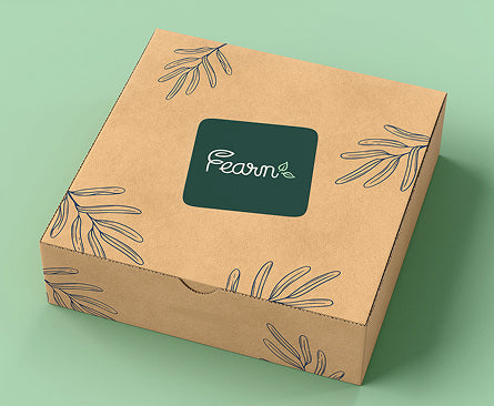 Kraft paper box with 'Fearn' logo on a green background