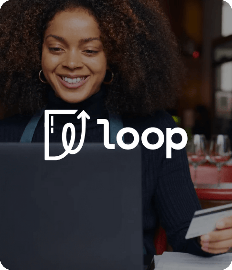 Woman using a laptop with 'loop' logo overlay