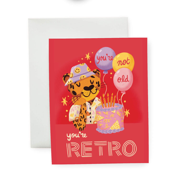 Greeting card with a retro-themed illustration of a leopard and balloons on a red background.