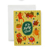 Greeting card with quirky illustrated tomatoes and 'It's Party Time!' text on a yellow background.
