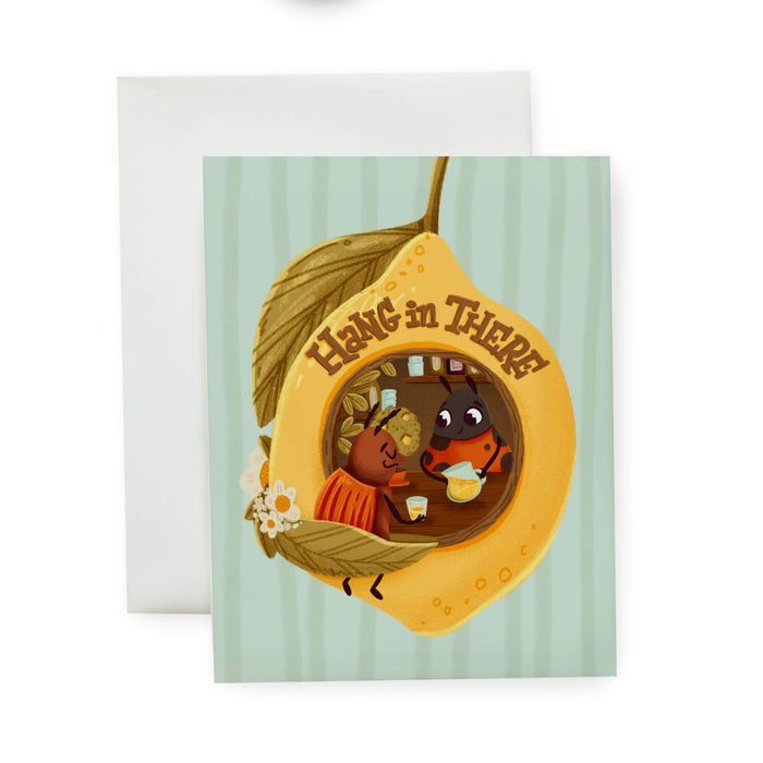 Greeting card with two insects inside a lemon, with text 'Hang in There'.