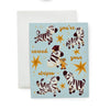 Graduation greeting card featuring stars and joyful zebras surrounding a white horse having it's stripes painted on by a little mouse.